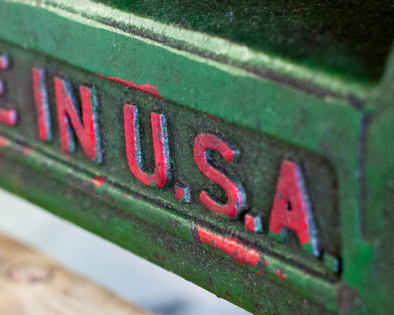 color-photograph-red-text-in-U.S.A-on-green-industrial-machinery