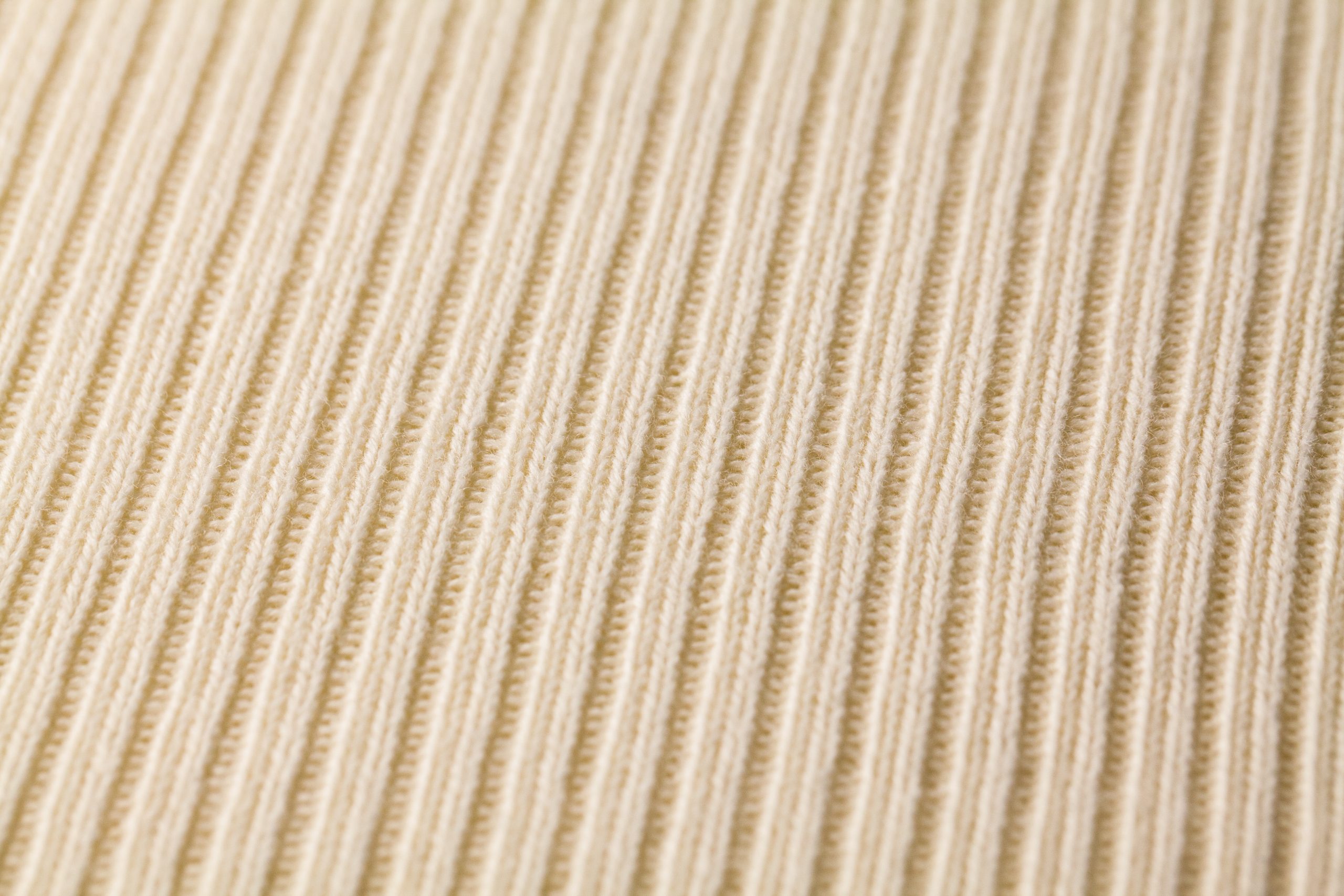 Custom stack of domestic wool knit samples manufactured on Shima Seiki WholeGarment flat garment knit machines